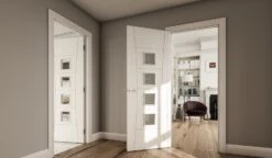 Pamplona Internal White Primed Clear Glazed Door -Home Door Shop ed pamplona white primed glazed door hallway 1